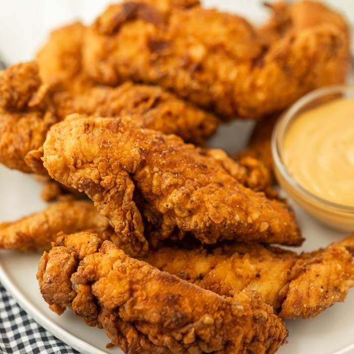A picture of Chick-fil-A chicken tenders on a plate.